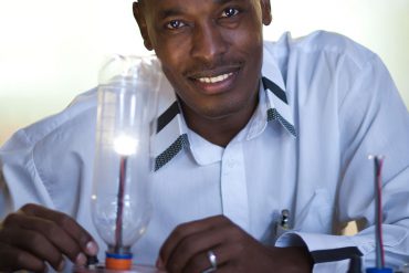 Boniface Njuguna with his solar-powered device.