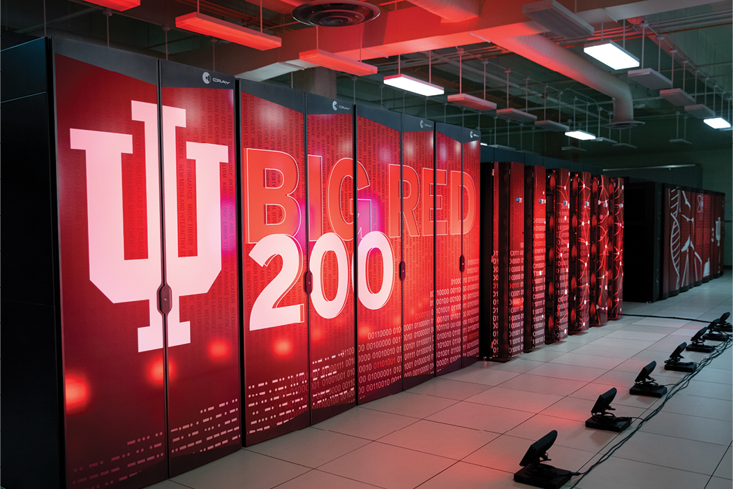 "Big Red 200" is emblazoned in huge letters on the front of a set of vertical cabinets stacked side-by-side in a room stretching the length of the photo and out of frame.